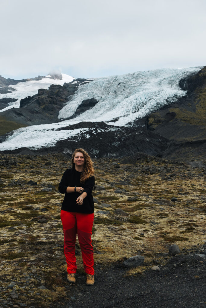 Switzerland Elopement Photographer standing in front of glacier