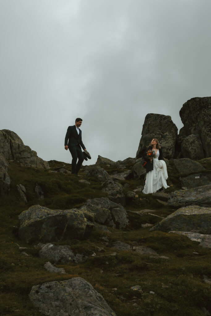 A couple hikes in the Swiss alps during their elopement in Switzerland