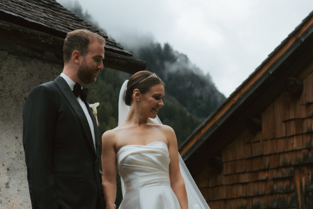 A couple looks at their guests during their wedding in Switzerland