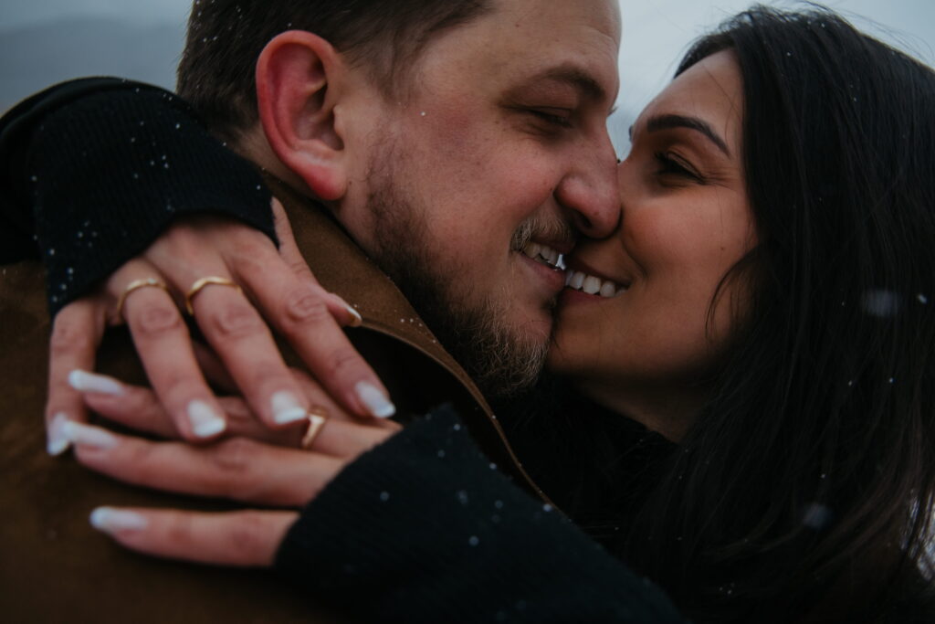 Couple kissing in Andermatt, switzerland